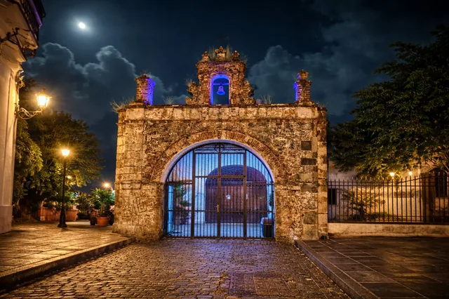Student group posing at the historic San Juan Gate entrance to the old city