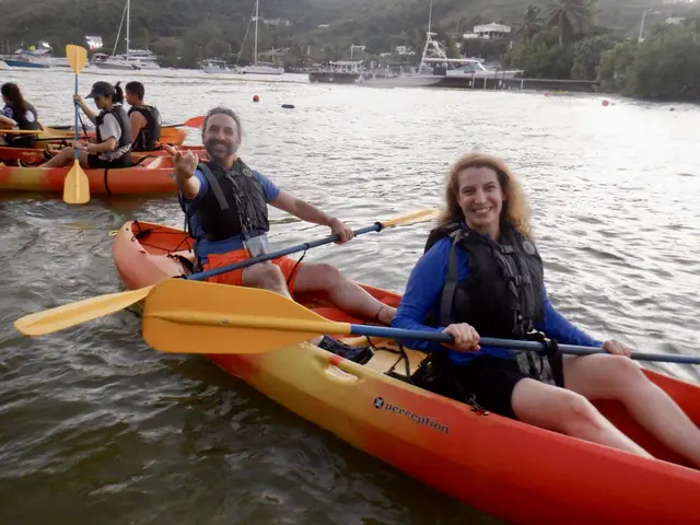 Group of kayakers on calm water at sunset Fajardo