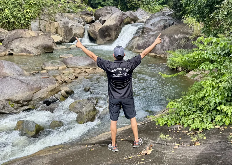 Hidden waterfall and natural pools at Charco El Hippie in El Yunque rainforest