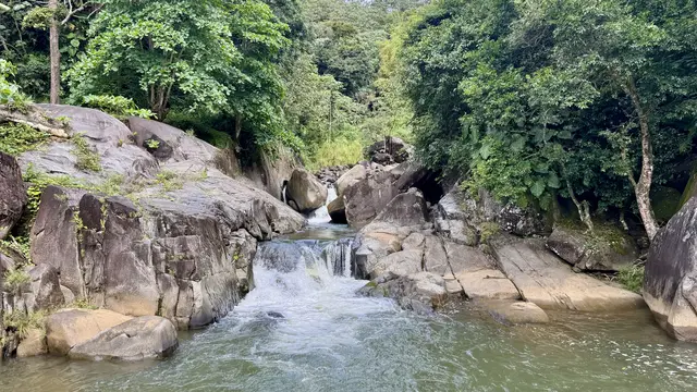 Cascading river pools and natural rock formations at Charco El Hippie Puerto Rico