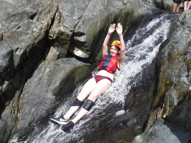 Natural rock waterslide with rushing water in El Yunque